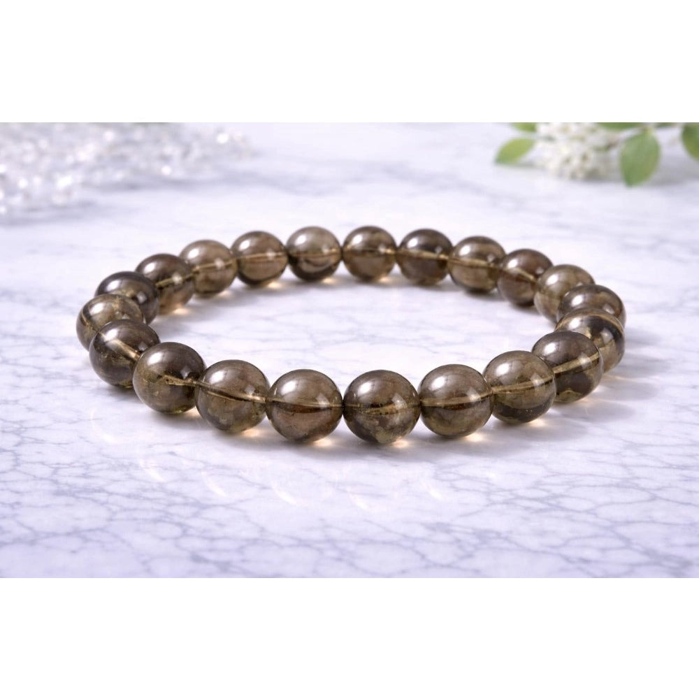 Suvarnika Natural Crystal 8mm Smoky Quartz Bracelet  (Brown)